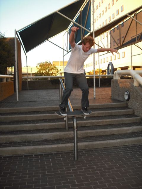 Pat Stiener with a bomb drop boardslide