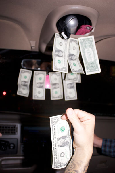 Taping bills all over the cab