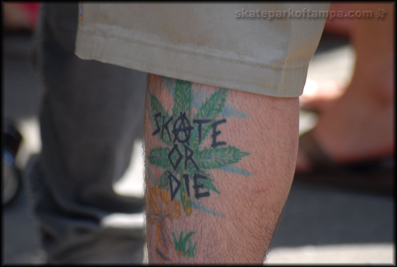 Tattoo with a mushroom, pot leaf, and anarchy