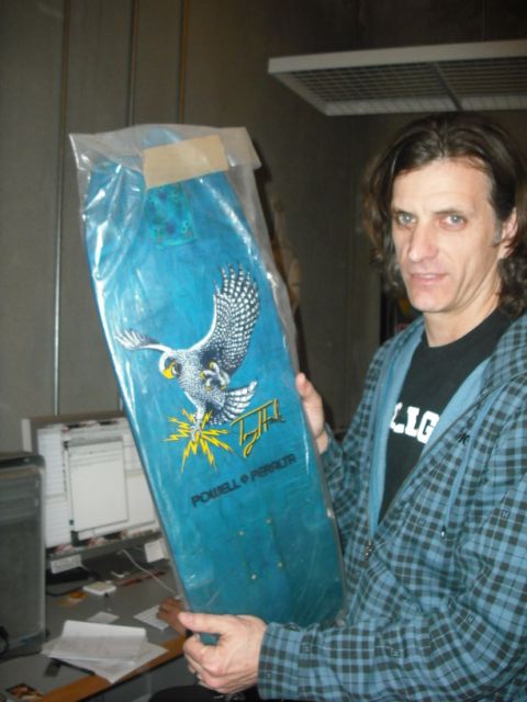 Miki Vukovich holding a Hawk deck