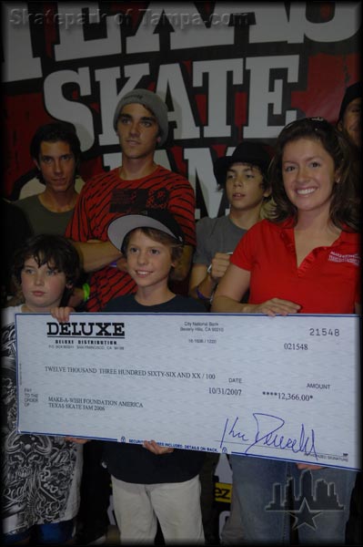 That's Johnny Romano presenting a check to Make-A-